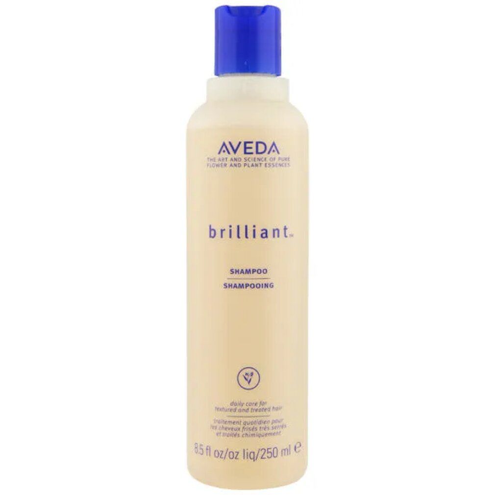 Beige Shampoo-Flasche mit blauem Deckel. Aufschrift: Aveda, brilliant. Shampoo. 250 ml. Vegan-Logo.