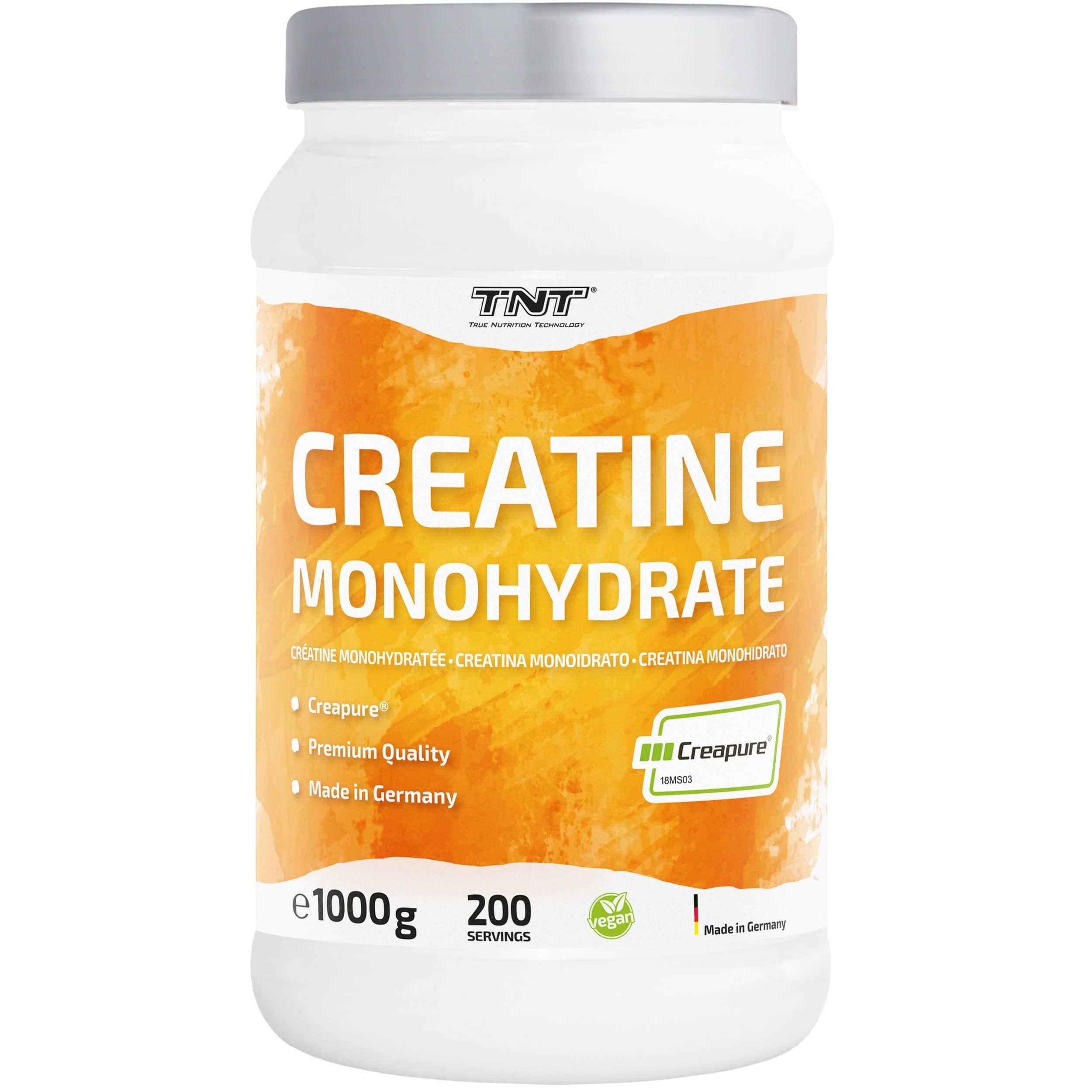 Weißes TNT-Behälter mit orangefarbenem Etikett. Aufschrift: Creatine Monohydrate, Creapure, 1000g, 200 Portionen. Vegan-Siegel.