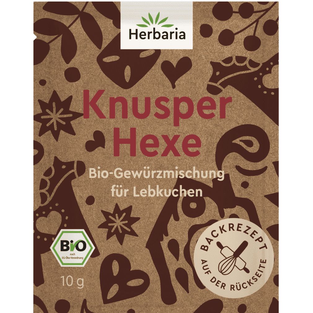 Verpackung mit Aufdruck. Oben links: Logo Herbaria. Schriftzug: Knusper Hexe. Bio-Gewürzmischung für Lebkuchen. Bio-Siegel. 10 g. Aufdruck: Backrezept auf der Rückseite.