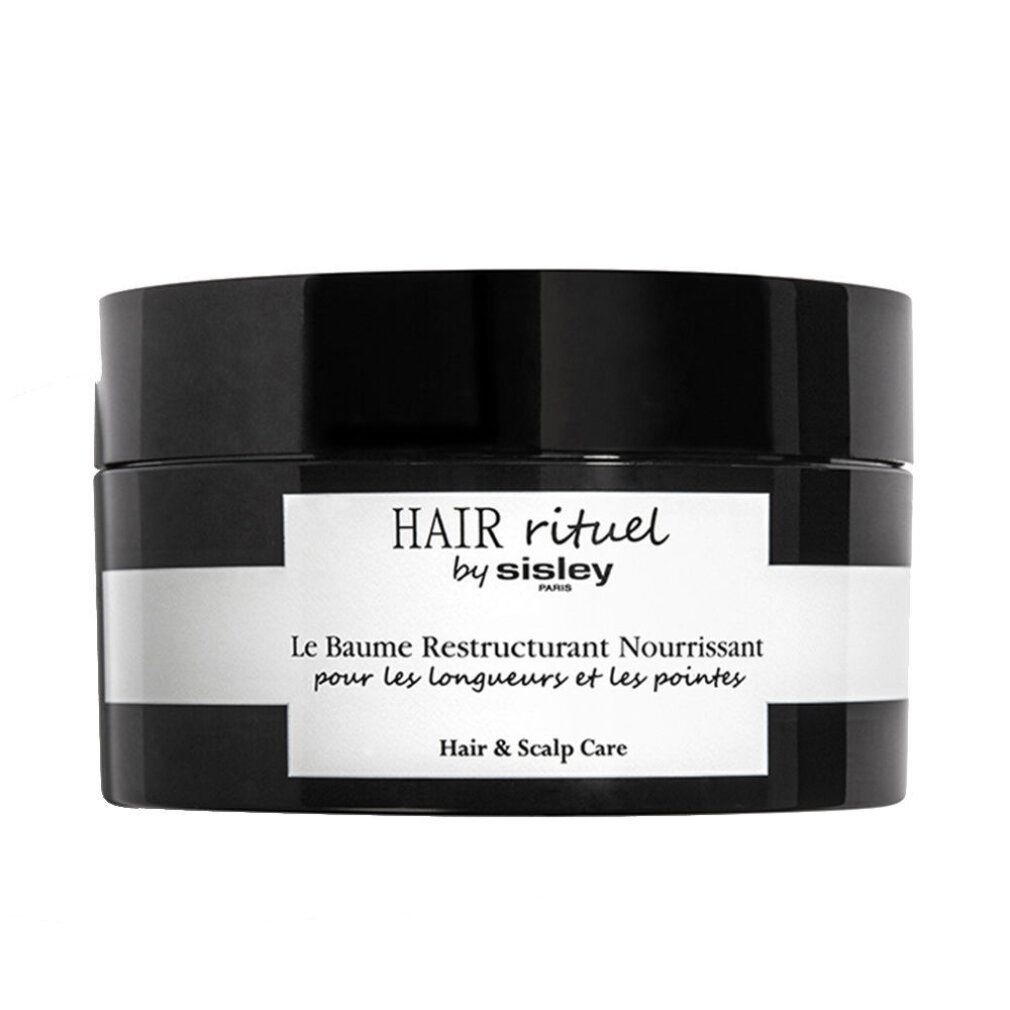 Schwarzer Tiegel mit weißem Etikett. Aufschrift: HAIR rituel by sisley PARIS. Le Baume Restructurant Nourrissant pour les longueurs et les pointes. Hair & Scalp Care.