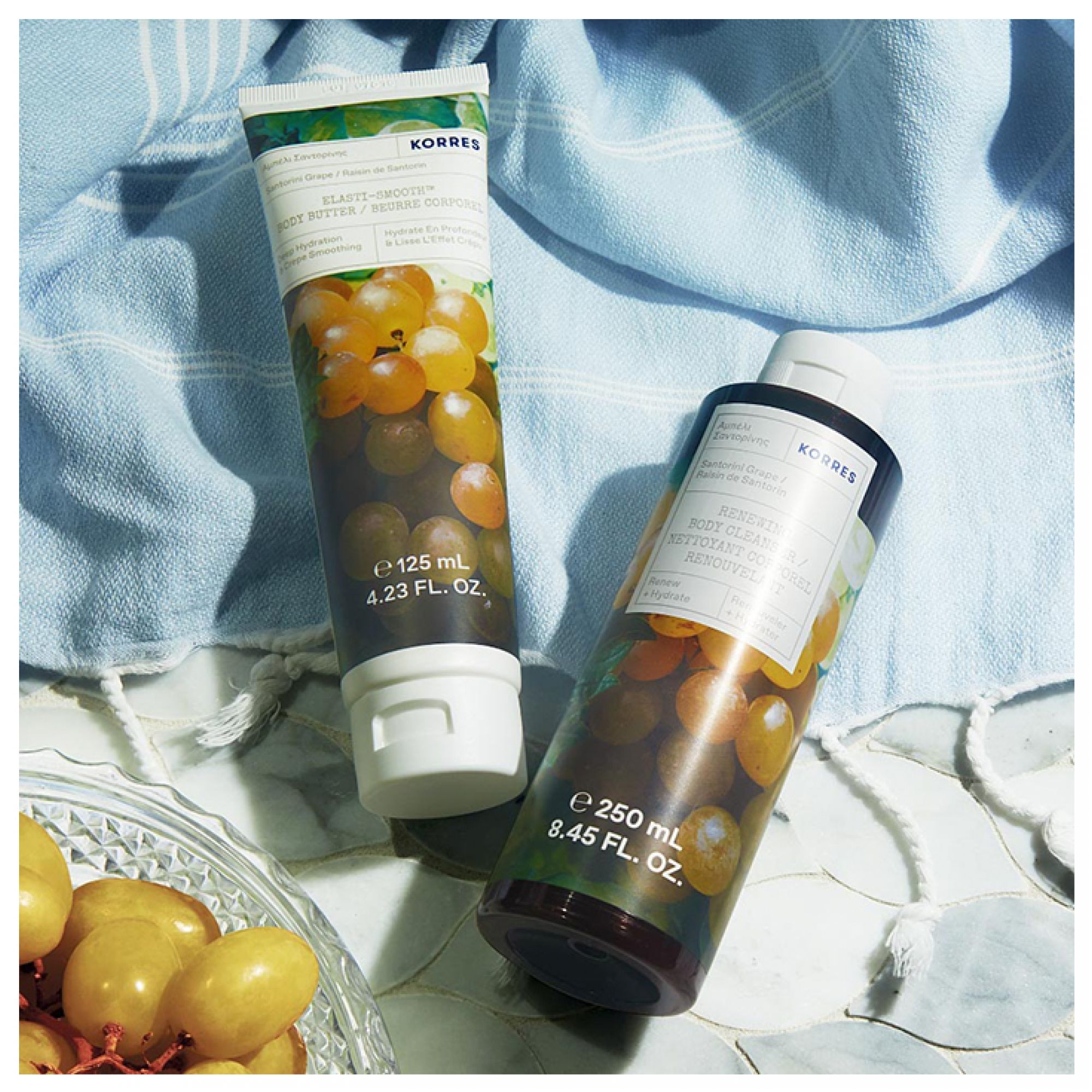 Korres Körpermilch (125ml) und Duschgel (250ml) mit Traubenmotiv.