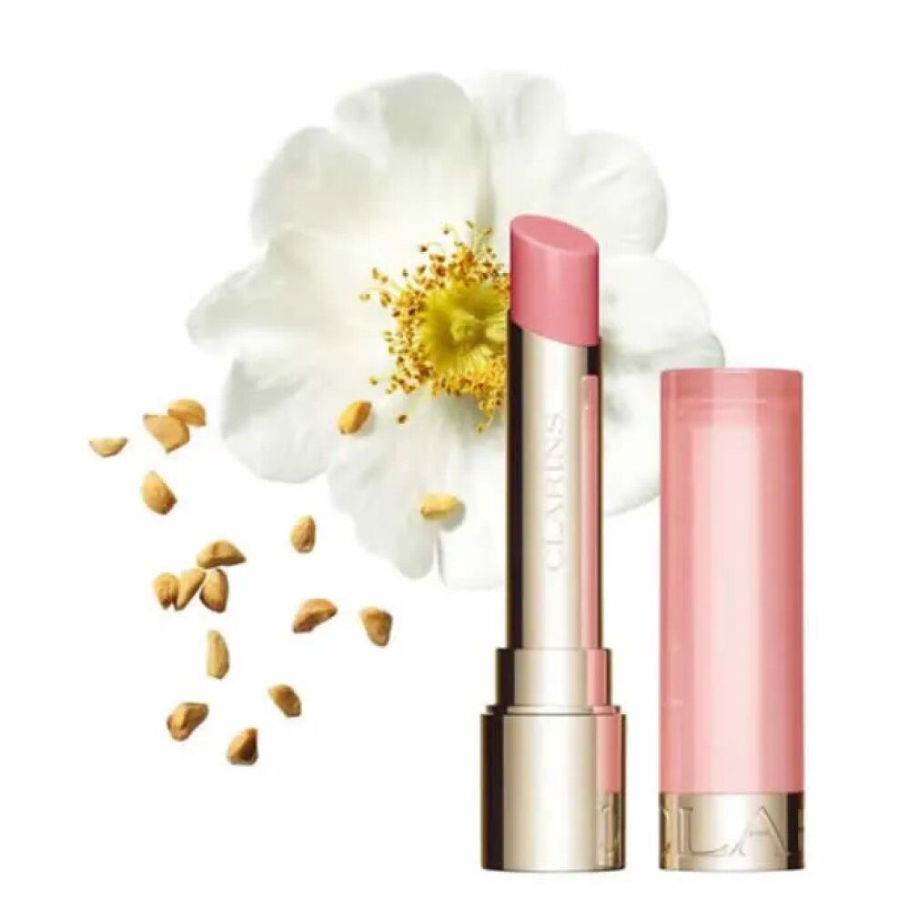 Weiße Rose, Samen und Lippenbalsam. Marke Clarins sichtbar. Geöffnet und geschlossen dargestellt.
