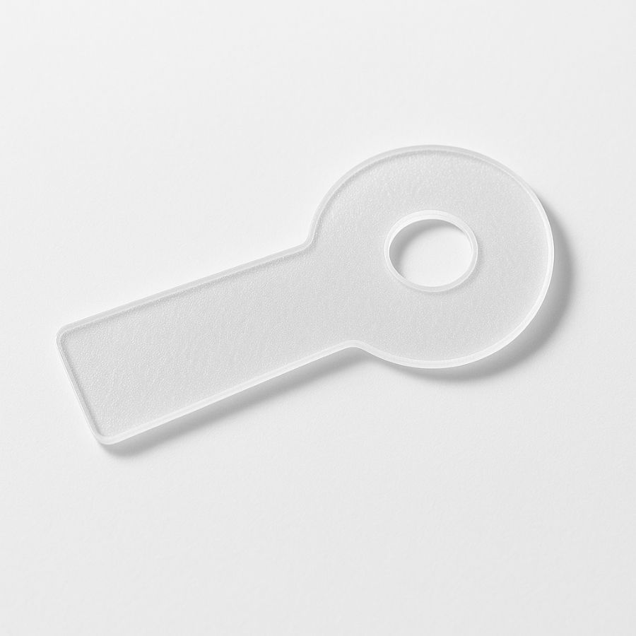 Silikonpflaster, weiß, mit rundem Teil und langem Griff. Loch im runden Teil. Auf weißem Hintergrund.