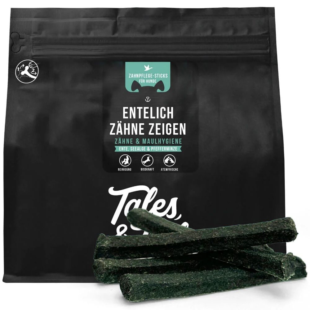 Schwarze Verpackung mit Produktnamen und Kausticks. Aufschrift: EnteLich Zähne Zeigen. Zähne & Maulhygiene. Kausticks liegen davor.