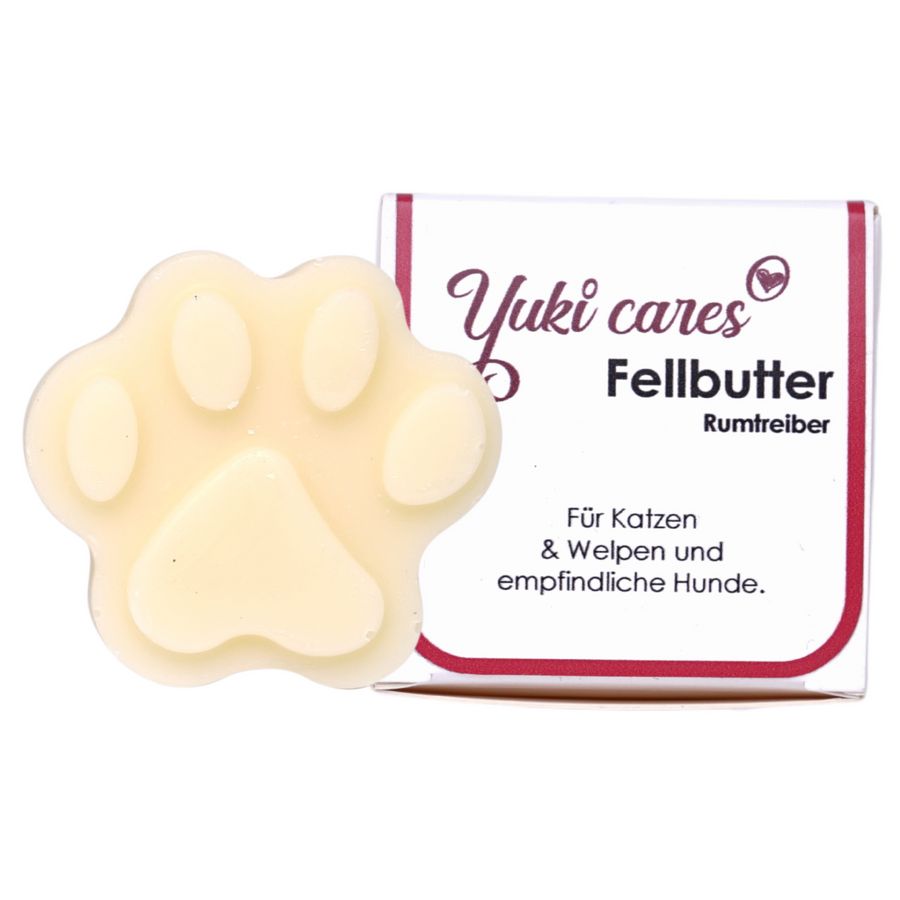 Pfotenformiges Produkt neben Verpackung. Verpackung mit Text: Yuki cares Fellbutter Rumtreiber. Für Katzen & Welpen und empfindliche Hunde.