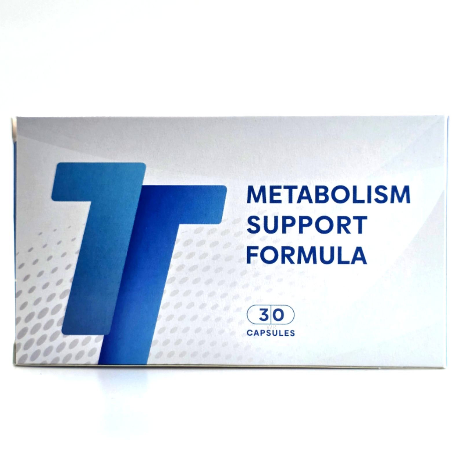 Schachtel mit "METABOLISM SUPPORT FORMULA" und 30 Kapseln. Blaues Logo "TT". Weißer Hintergrund.