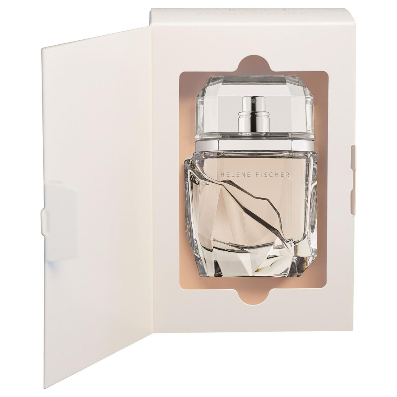 Parfümflakon in geöffneter Verpackung. Eckiger Flakon aus Glas. Verpackung weiß.