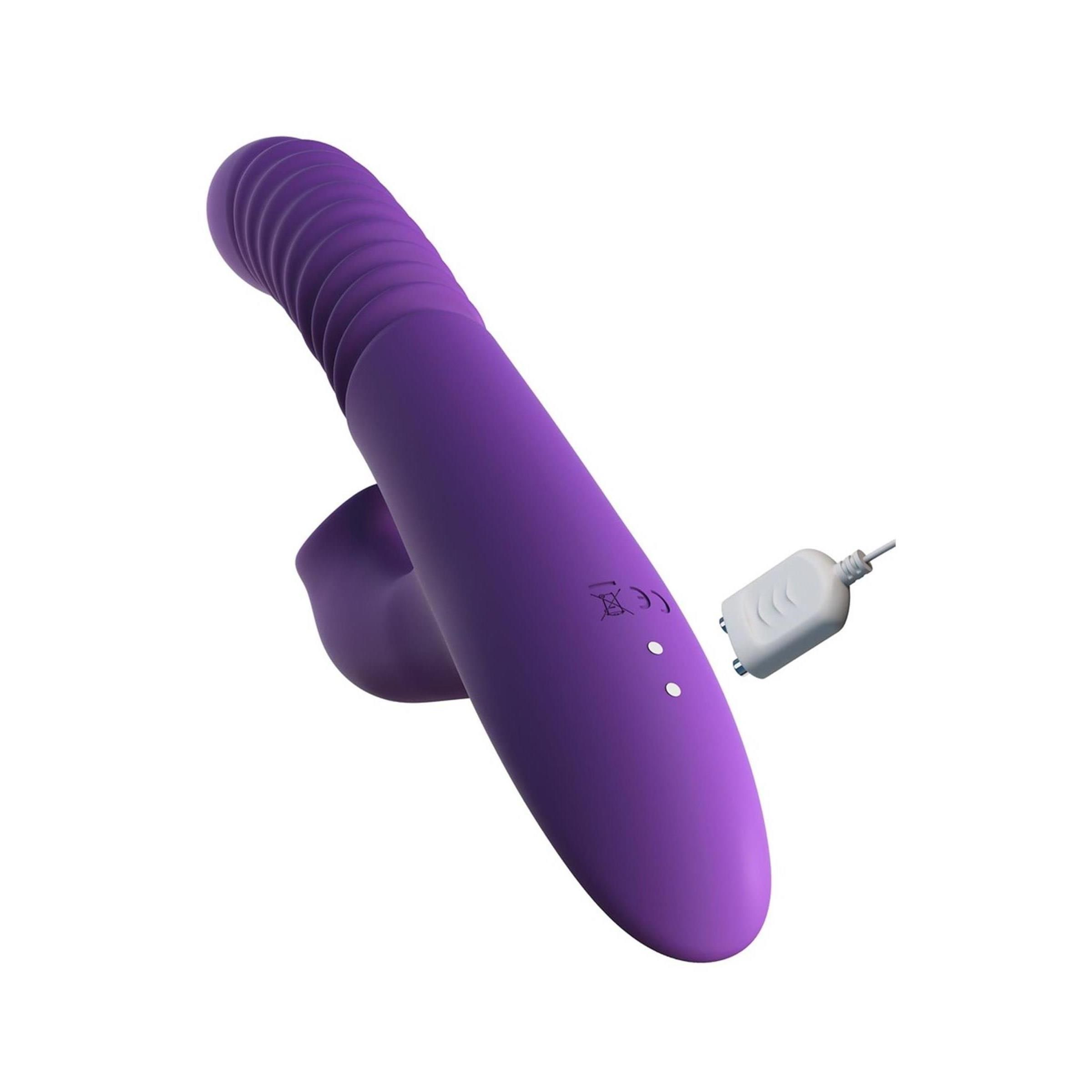 Lila Stimulator mit Ladegerät. Enthält einen Stimulator und ein weißes Ladegerät.