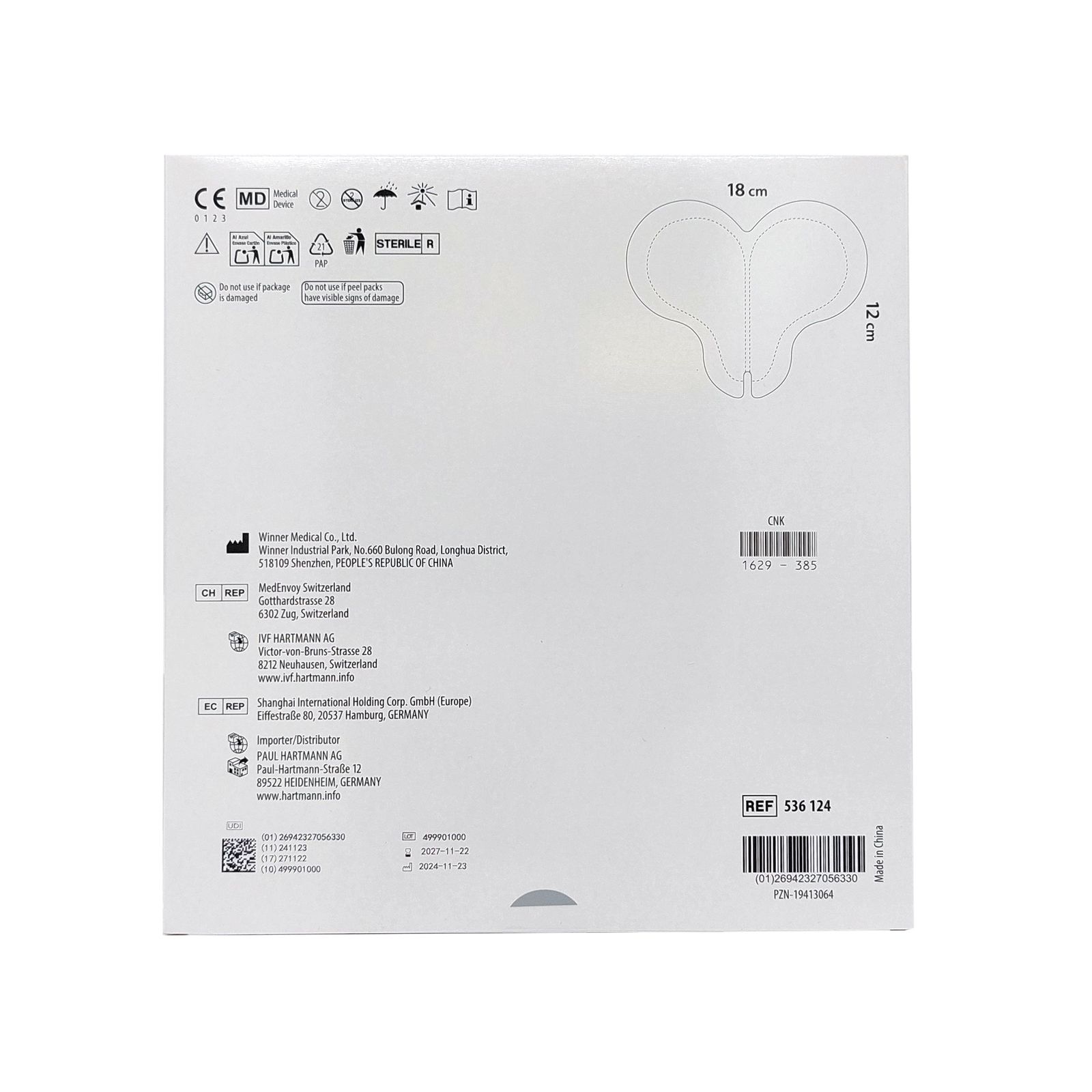 Verpackung mit Produktabbildung. Quadratisch, weiß. Maße: 18 cm x 12 cm. Medizinprodukt. Text und Symbole.