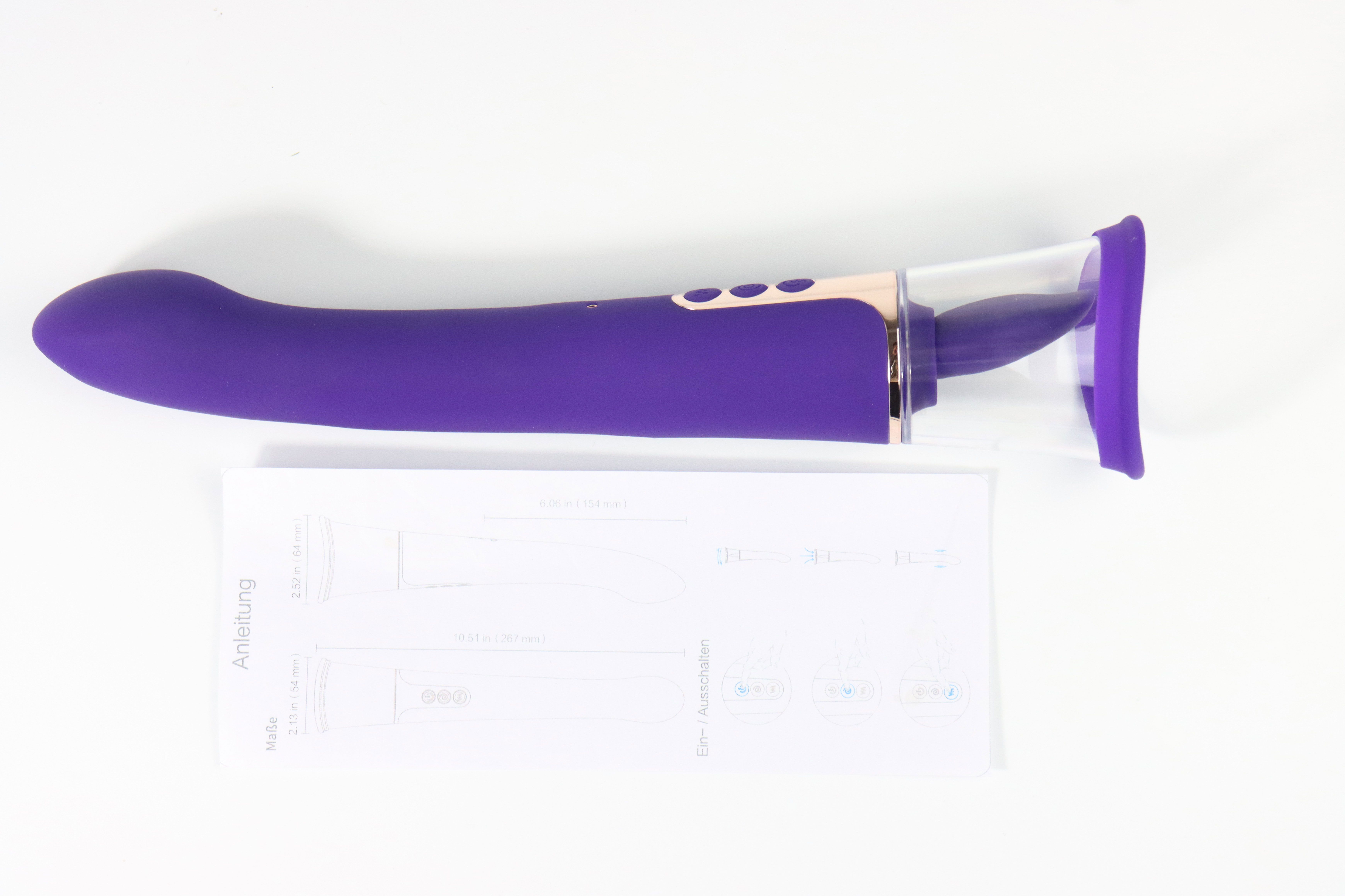 Lila Vibrator mit Bedienungsanleitung. Transparenter Aufsatz. Drei Knöpfe.