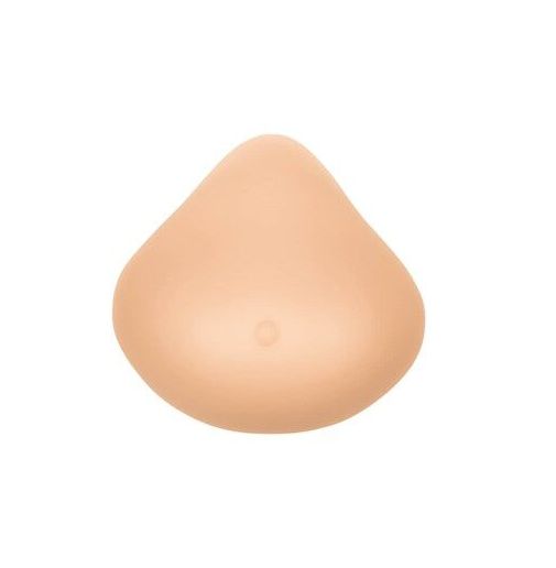 Brustprothese in Hautfarbe. Tropfenförmig, mit einer kleinen Aussparung. Glatte Oberfläche.