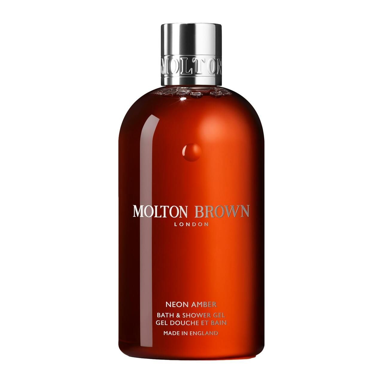 Braune Flasche mit silbernem Deckel. Aufschrift: Molton Brown London, Neon Amber, Bath & Shower Gel, Made in England.