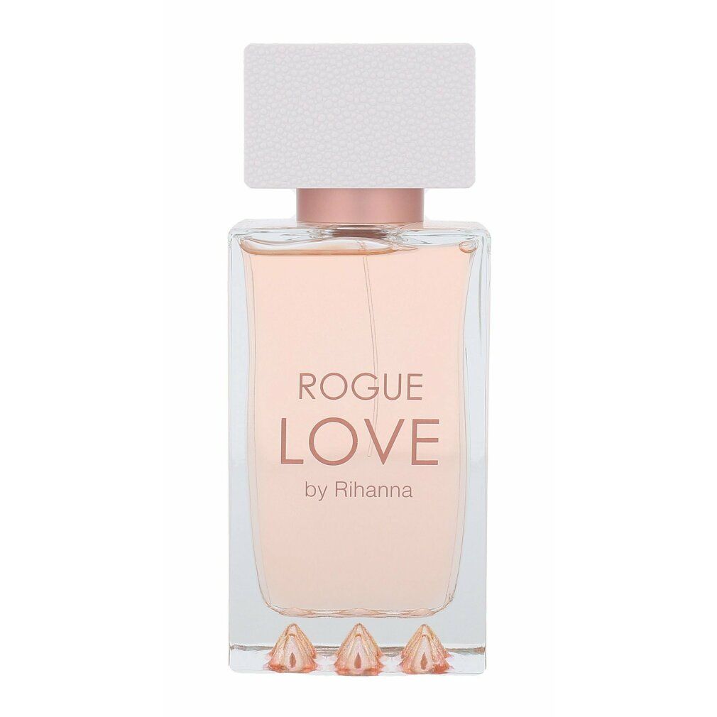 Parfümflakon mit rosa Flüssigkeit. Aufschrift: ROGUE LOVE by Rihanna. Unten drei pyramidenförmige Elemente.