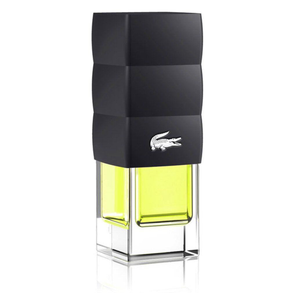 Lacoste Challenge Eau de Toilette Spray. Schwarze Flasche mit gelber Flüssigkeit. Weißes Krokodil-Logo.