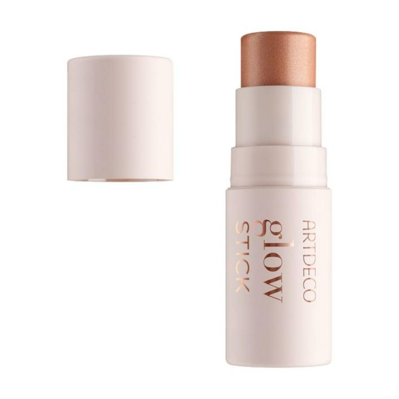 Artdeco Glow Stick. Offene, hellrosa Verpackung. Goldfarbener Schriftzug: Glow Stick. Sichtbare, bronzefarbene Spitze.