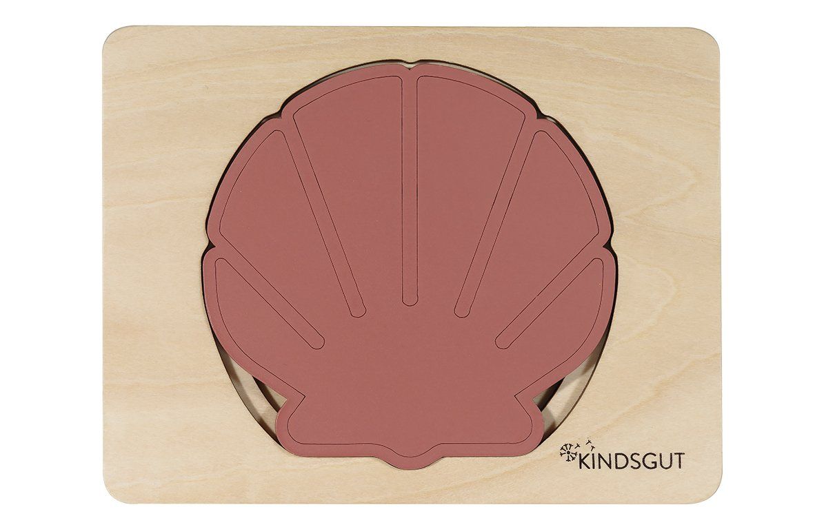 Holzpuzzle mit Muschelform. Rosa Muschelteil in Holzrahmen. Kindsgut Logo rechts unten.