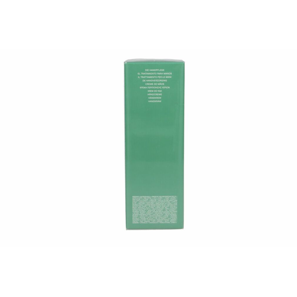 Grüne Verpackung. Text in mehreren Sprachen. Aufschrift: Crème de Velours, Hand Treatment.