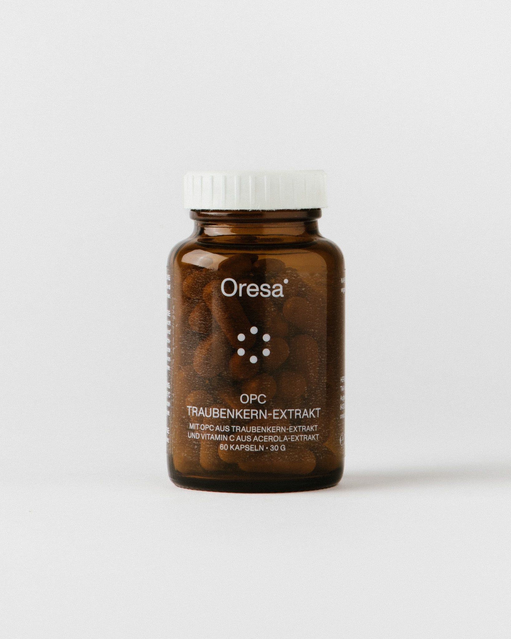 Braune Glasflasche mit weißen Deckel. Aufschrift Oresa und OPC Traubenkern-Extrakt.
