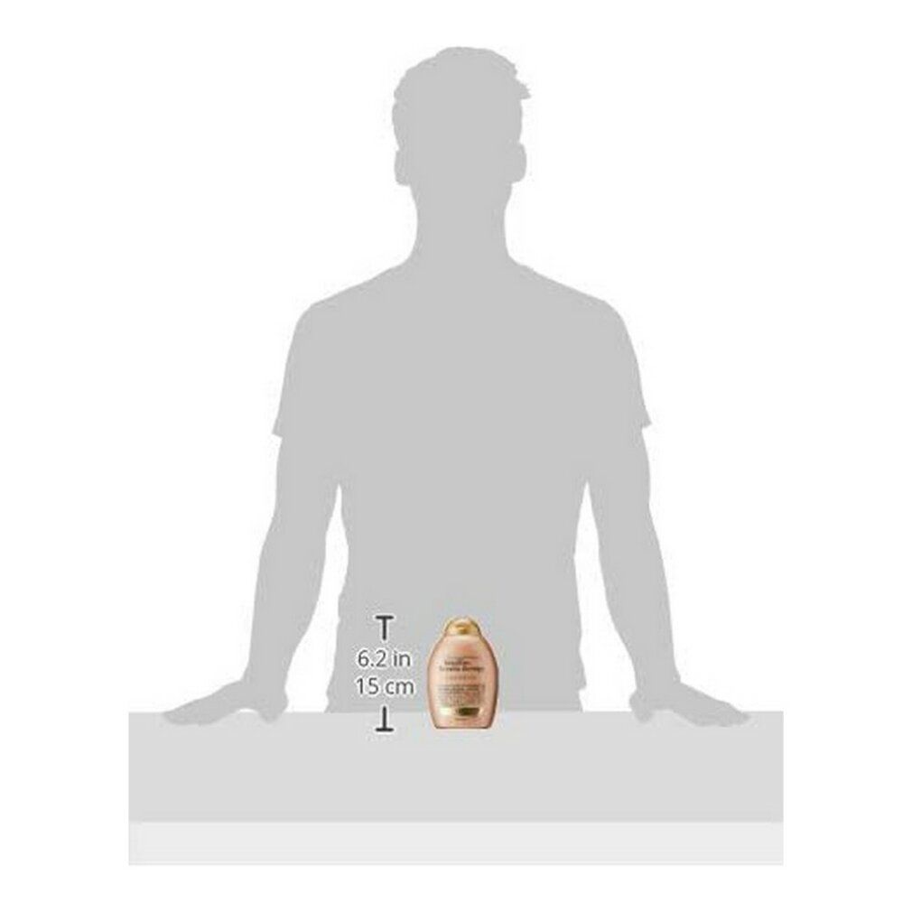 Person hält Shampoo-Flasche. Flasche: Brazilian Keratin Smooth Shampoo, beige, goldener Deckel. Maße: 15 cm hoch, 6,2 cm breit.