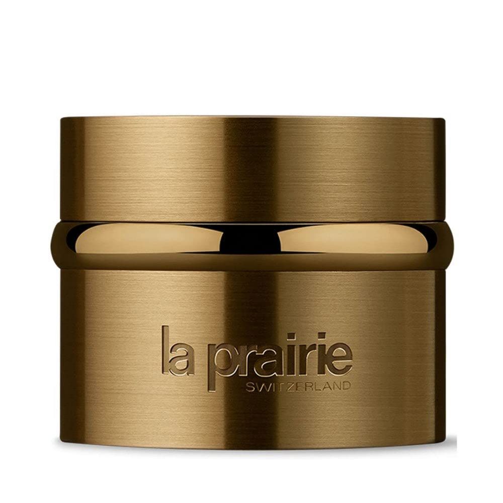 Goldfarbener Tiegel mit Deckel. Auf der Vorderseite steht "la prairie SWITZERLAND".