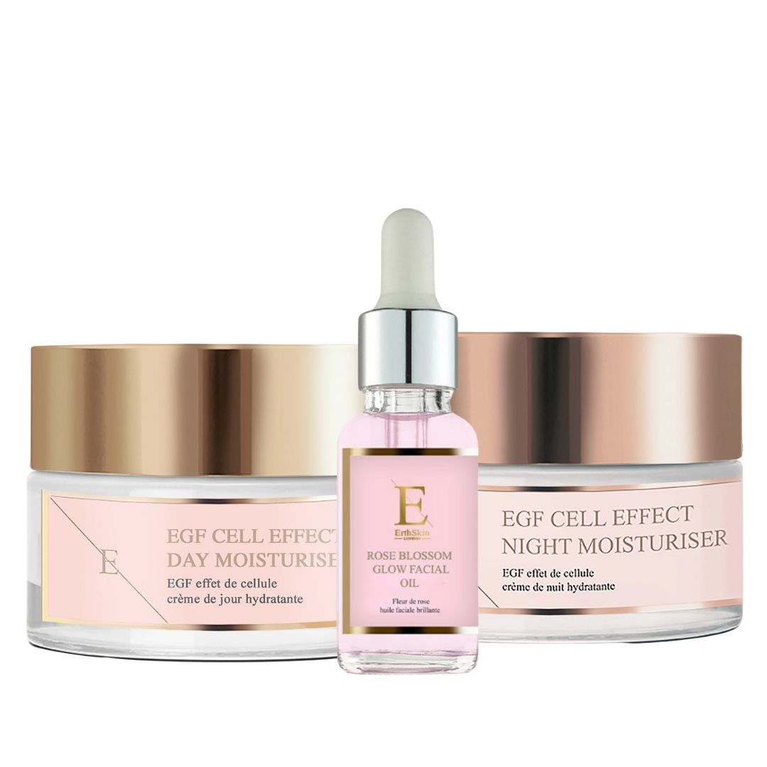 Drei Kosmetikprodukte: Tages- und Nachtcreme, Gesichtsöl. Rosa Etiketten, goldene Deckel. "EGF Cell Effect" und "Rose Blossom Glow".