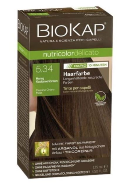 Haarfarbe-Verpackung. Braun, mit grünen und weißen Akzenten. Enthält Informationen zu Inhaltsstoffen und Anwendung.