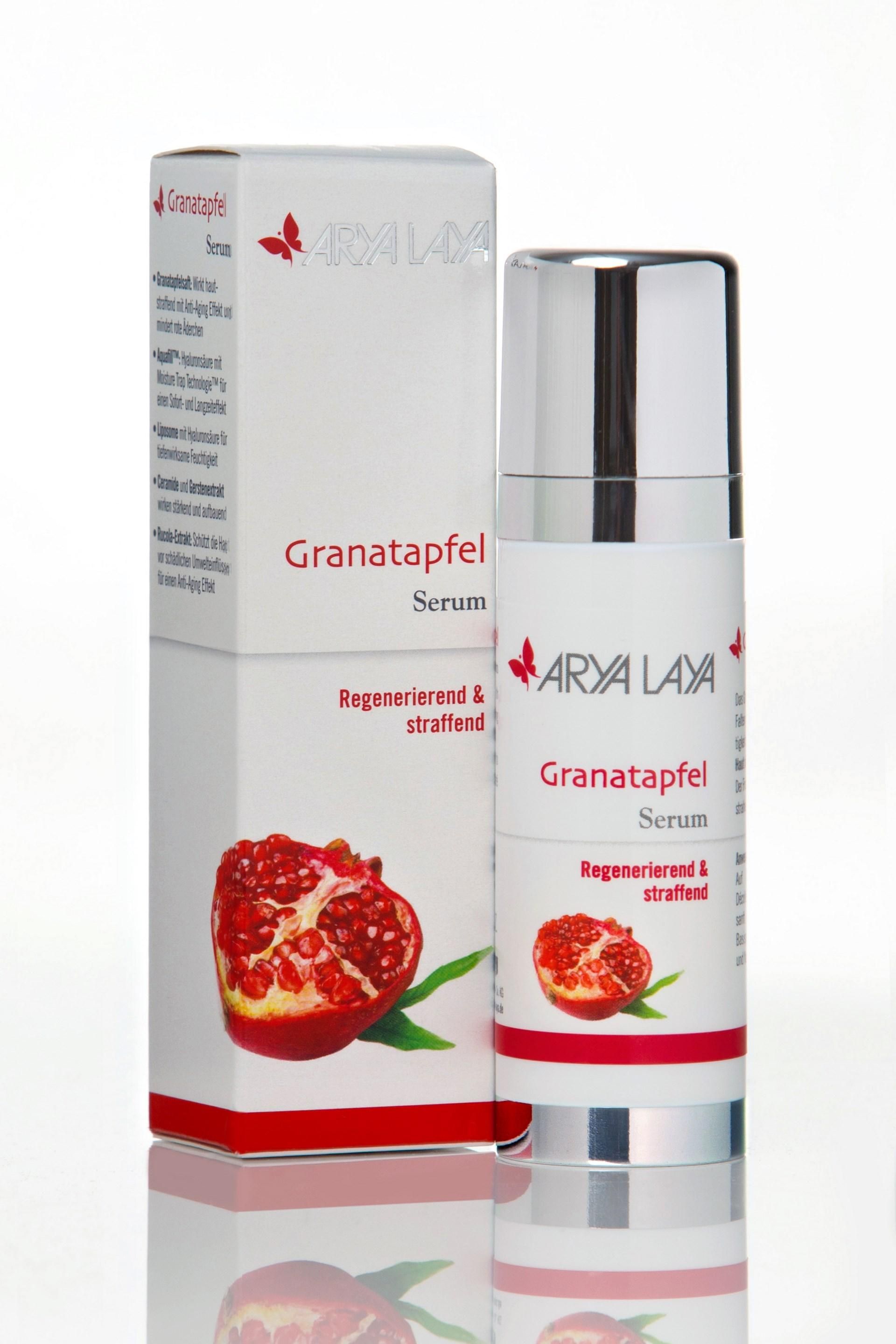 Serum-Flakon und -Verpackung. Aufschrift: Arya Laya Granatapfel Serum. Abbildung einer Granatapfel-Hälfte.