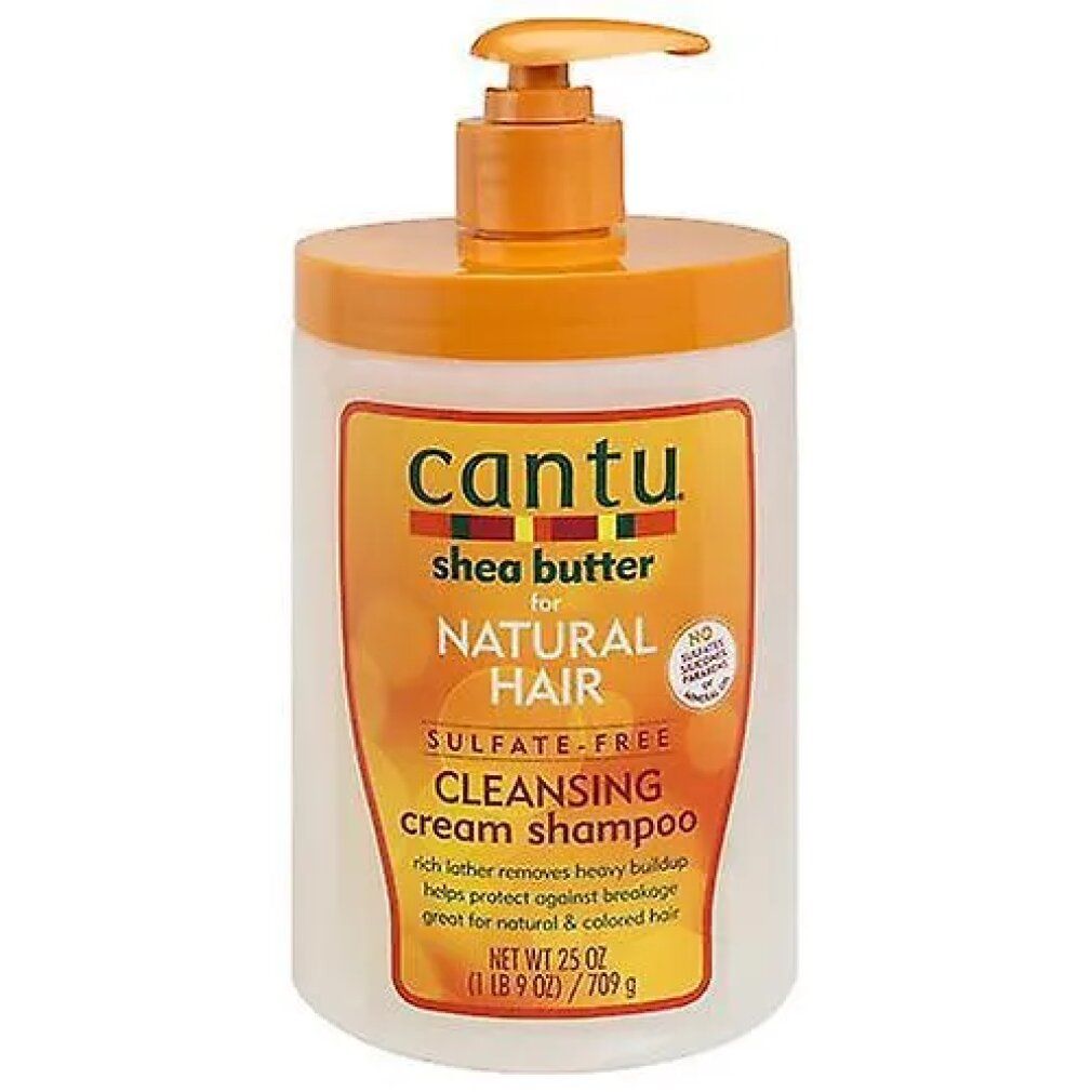 Shampoo-Flasche mit Pumpverschluss. Aufschrift: Cantu, Shea Butter, Natural Hair, Cleansing Cream Shampoo. Orange-weißes Design.