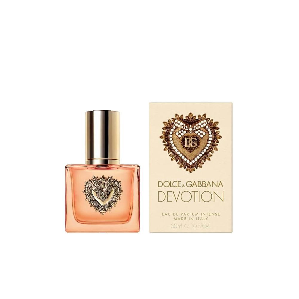 Parfümflakon und Schachtel. Flakon mit Herz-Dekor. Aufschrift: Dolce & Gabbana Devotion Eau de Parfum Intense. Made in Italy.