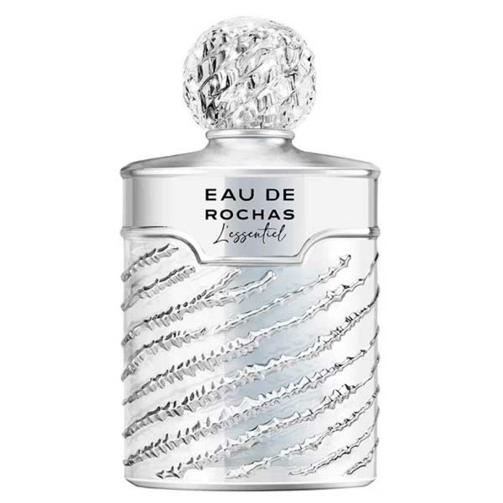 Silberfarbener Flakon mit geriffelter Oberfläche und Kappe. Aufschrift: Eau de Rochas L'Essentiel.