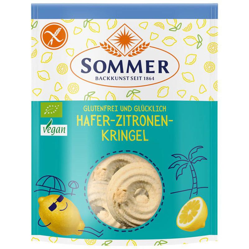 Verpackung mit "Sommer" Gebäck. Aufschrift: Glutenfrei, Hafer-Zitronen-Kringel. Vegan-Siegel. Abbildung von Zitronen und Kringeln.