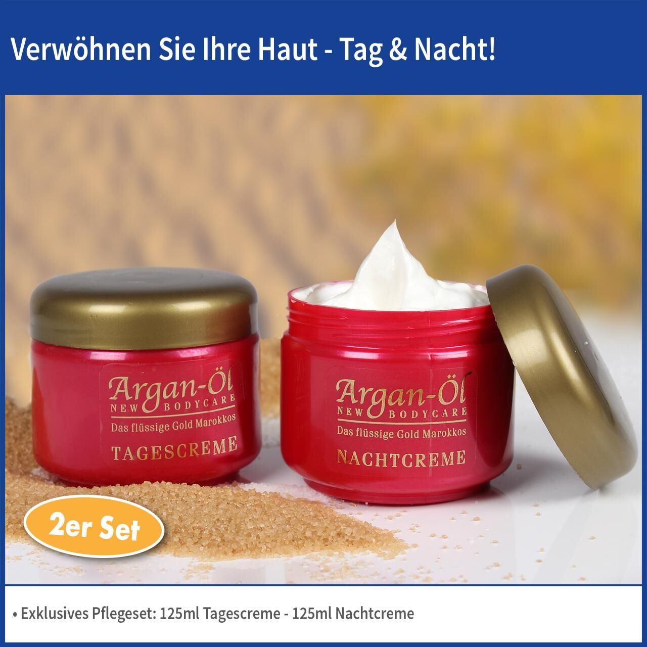 Zwei rote Tiegel mit goldenen Deckeln. Aufschrift: Argan-Öl, Nachtcreme und Tagescreme. Ein Tiegel geöffnet mit Creme. Text: 2er Set.
