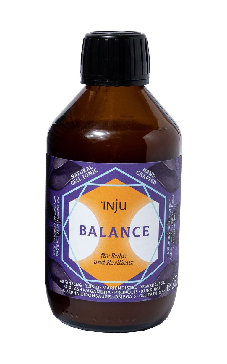 Braune Glasflasche mit lila Etikett. Text: INJU BALANCE, NATURAL CELL TONIC, für Ruhe und Restilienz. Mit Inhaltsstoffen.