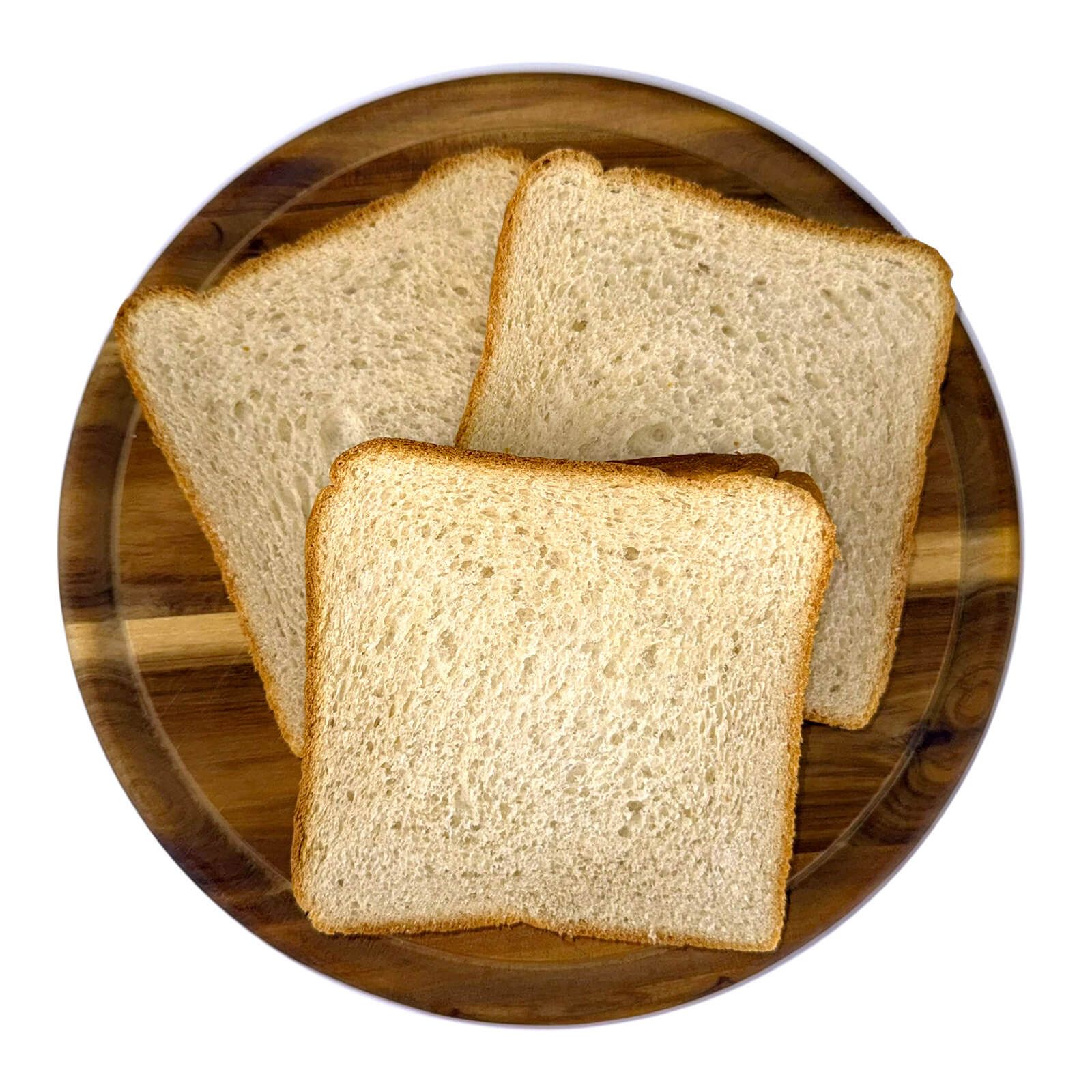 Drei Scheiben Locawo High Protein & Low Carb Butter Toast auf einem Holzbrett.