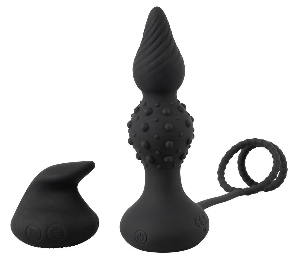 Schwarzer Analvibrator mit gerillter Spitze, Noppen und zwei Penisringen.