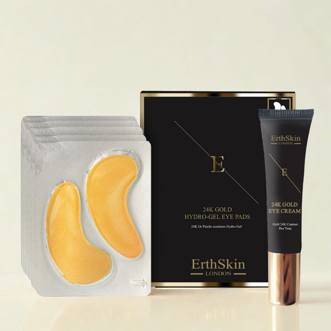 Augencreme und Augenpads-Set. Schwarze Verpackung mit Golddetails. Goldene Augenpads in Blisterverpackung. Tube mit goldener Kappe.