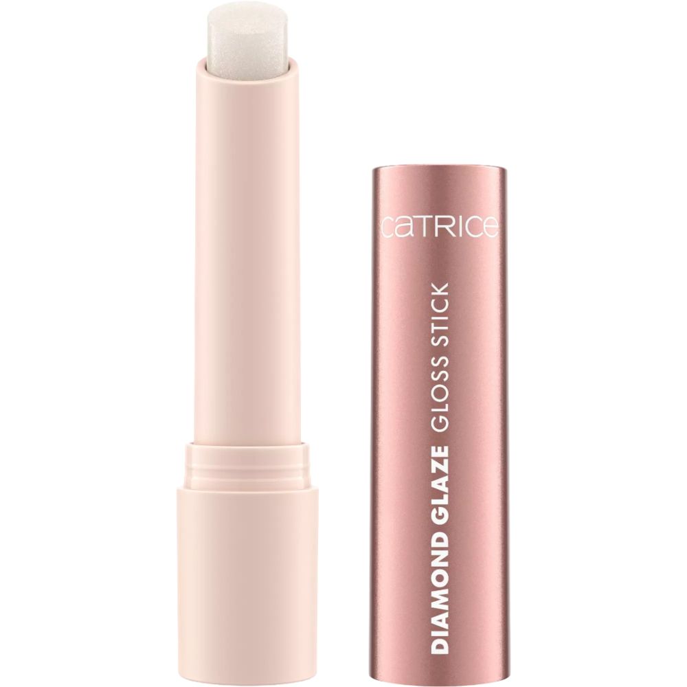 Ein heller Lippenstift in einem rosafarbenen Gehäuse mit aufgeschraubtem Deckel. Der Lippenstift ist weißlich und glänzend.