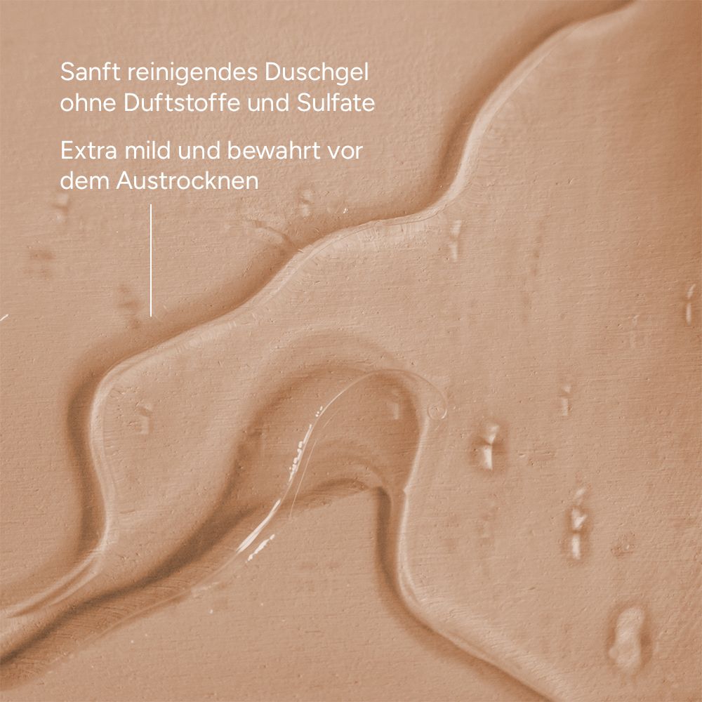 Nahaufnahme von durchsichtigem Duschgel. Text: Sanft reinigendes Duschgel ohne Duftstoffe und Sulfate. Extra mild und bewahrt vor dem Austrocknen.