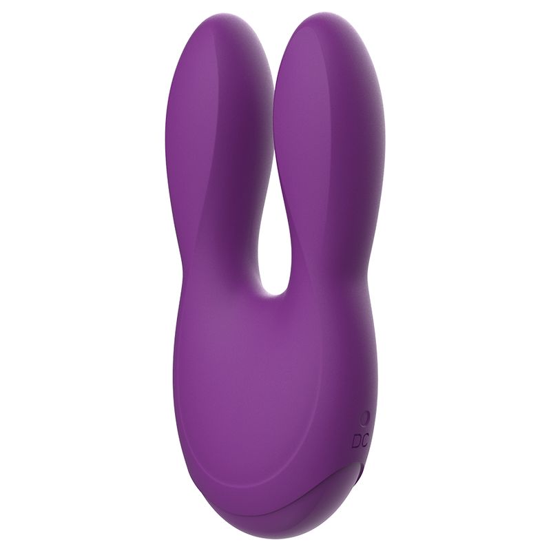Lila Stimulator mit zwei Flügeln. Power-Symbol und CE-Kennzeichnung sichtbar.