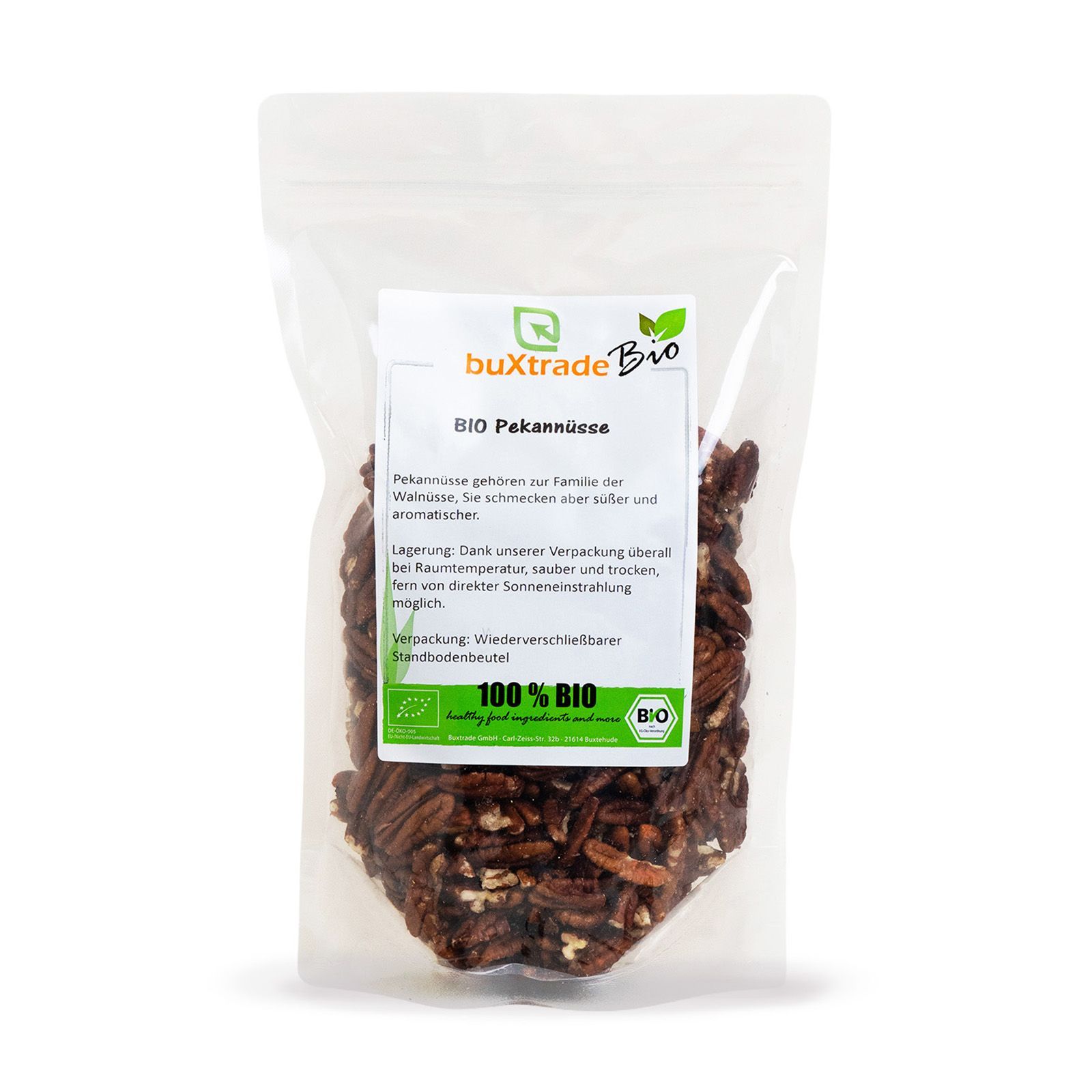Transparente Verpackung mit Pekannüssen. Aufdruck: buXtrade Bio Pekannüsse, 100% Bio-Siegel.