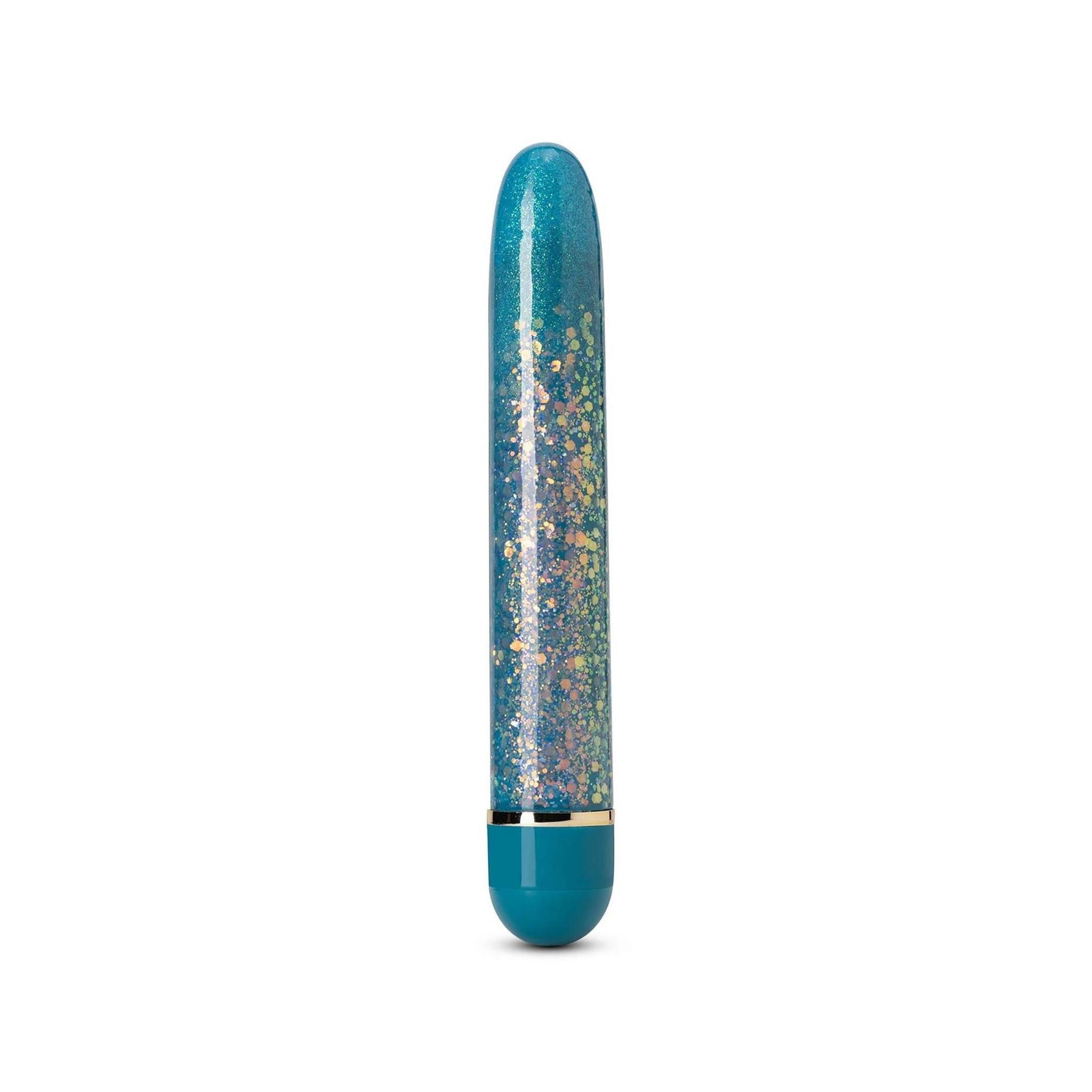 Türkises Wellness-Produkt mit Glitzer. Zylindrische Form, abgerundete Enden, Metallring am oberen Ende.
