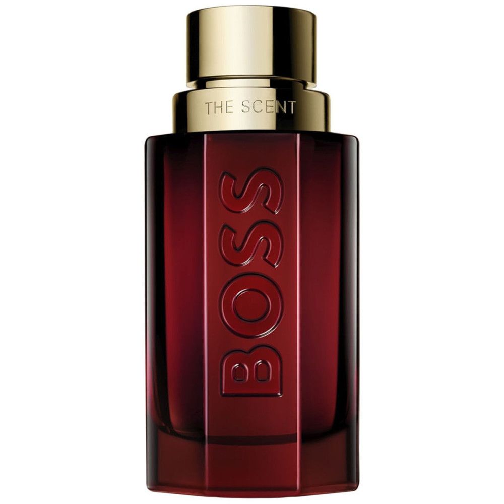 Roter Flakon mit goldfarbenem Verschluss. BOSS-Logo vertikal. Aufschrift "THE SCENT".
