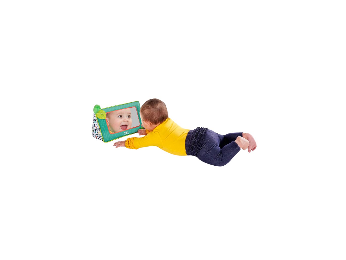 Baby liegt vor einem Spiegel. Spiegel mit grünem Rahmen und Blatt-Dekoration. Aufschrift "bright starts".