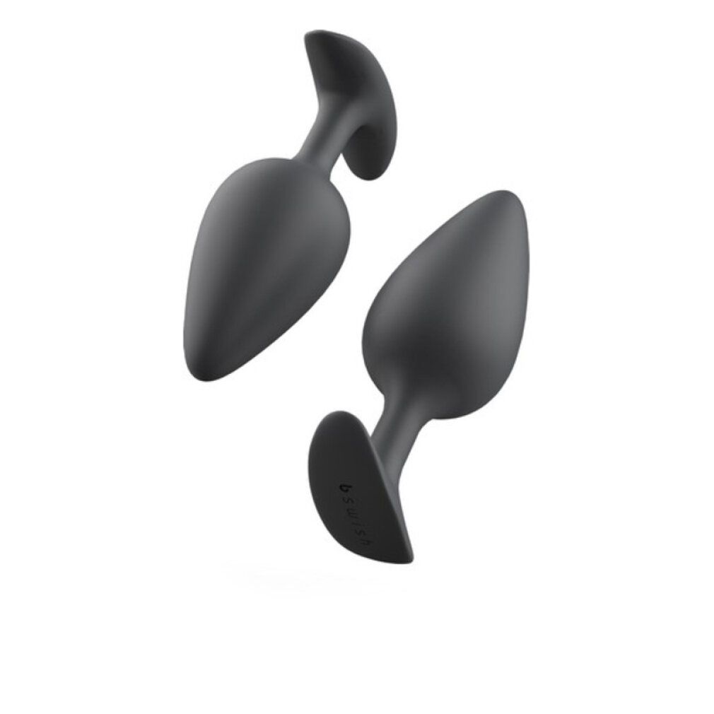 Zwei graue, konische Analplugs mit gebogenen Griffen. Die Basis ist flach und rund. Das Produkt ist freigestellt.