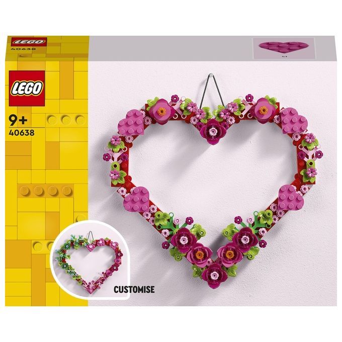 LEGO Creator 40638 Ornamento a cuore, gioco di costruzioni per bambini 9+. L'immagine mostra un ornamento a forma di cuore floreale appeso al muro. La confezione mostra il logo LEGO e le informazioni sul prodotto. Include mattoncini di vari colori.