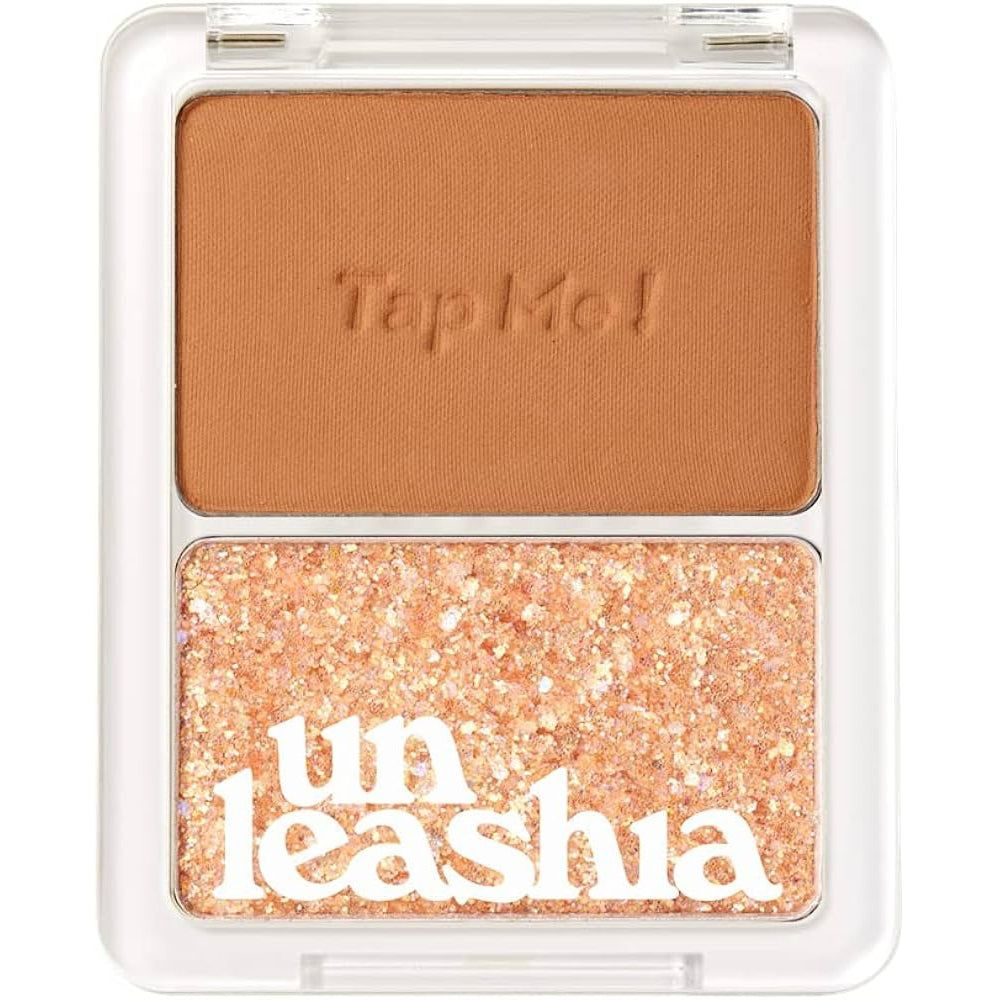 UNLEASHIA Tap Me Palette Duo. Zwei Farbtöne in einer transparenten Verpackung. Text: Tap Me!, Unleashia. Braune und glitzernde Farbtöne.