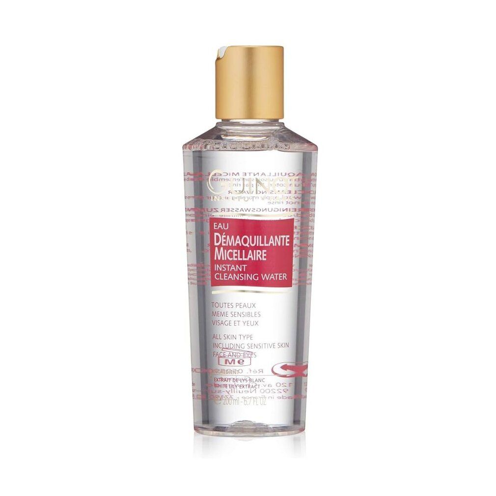 Transparente Flasche mit goldenem Deckel. Rotes Etikett mit Text: Eau Demaquillante Micellaire Instant Cleansing Water. Guinot Logo.