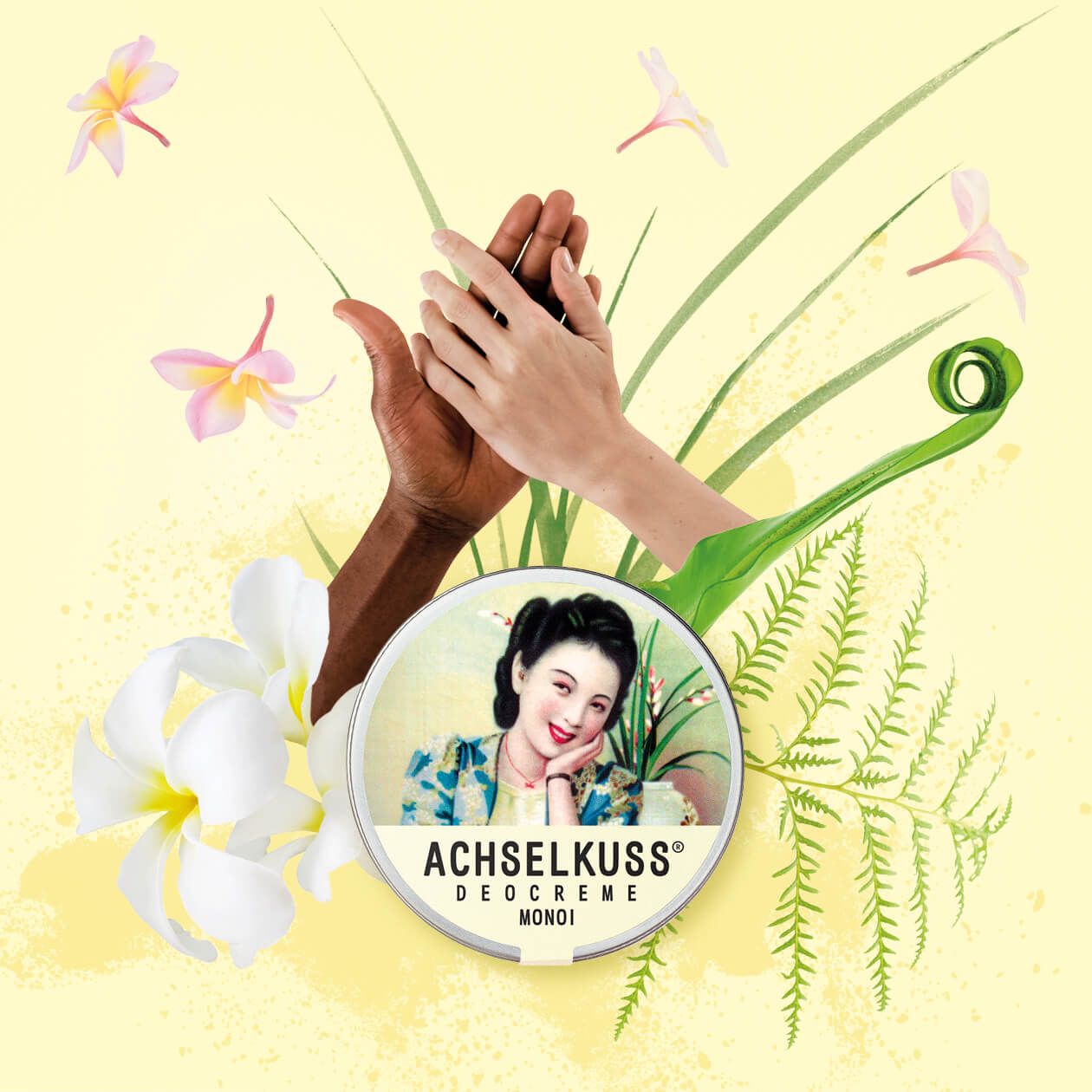 ACHSELKUSS Deocreme Monoi Dose umgeben von tropischen Blumen und Pflanzen.