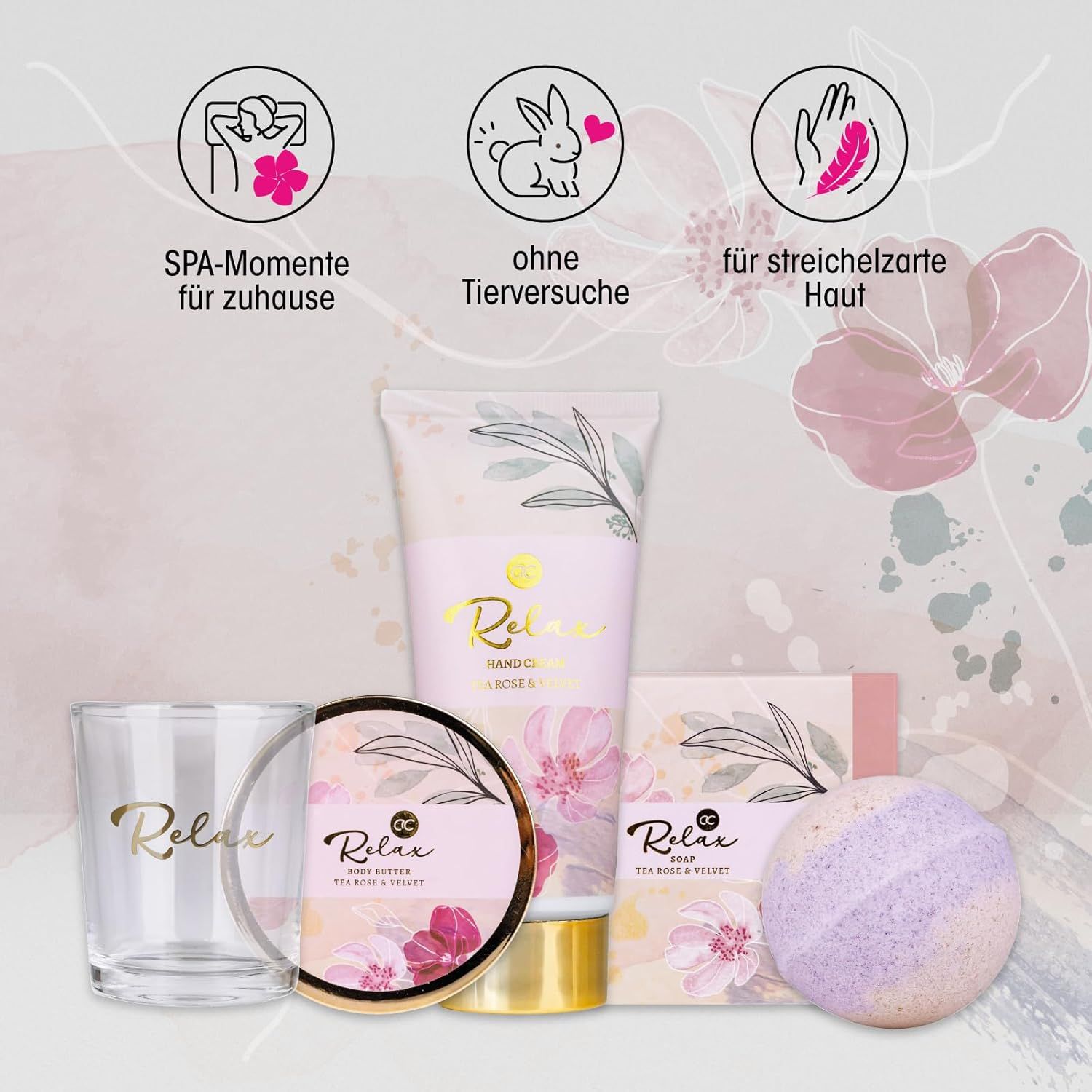 Geschenkset mit Bade- und Pflegeprodukten. Enthält Handcreme, Glas, Seife, Badekugel und Creme. Mit Symbolen und floralem Muster.