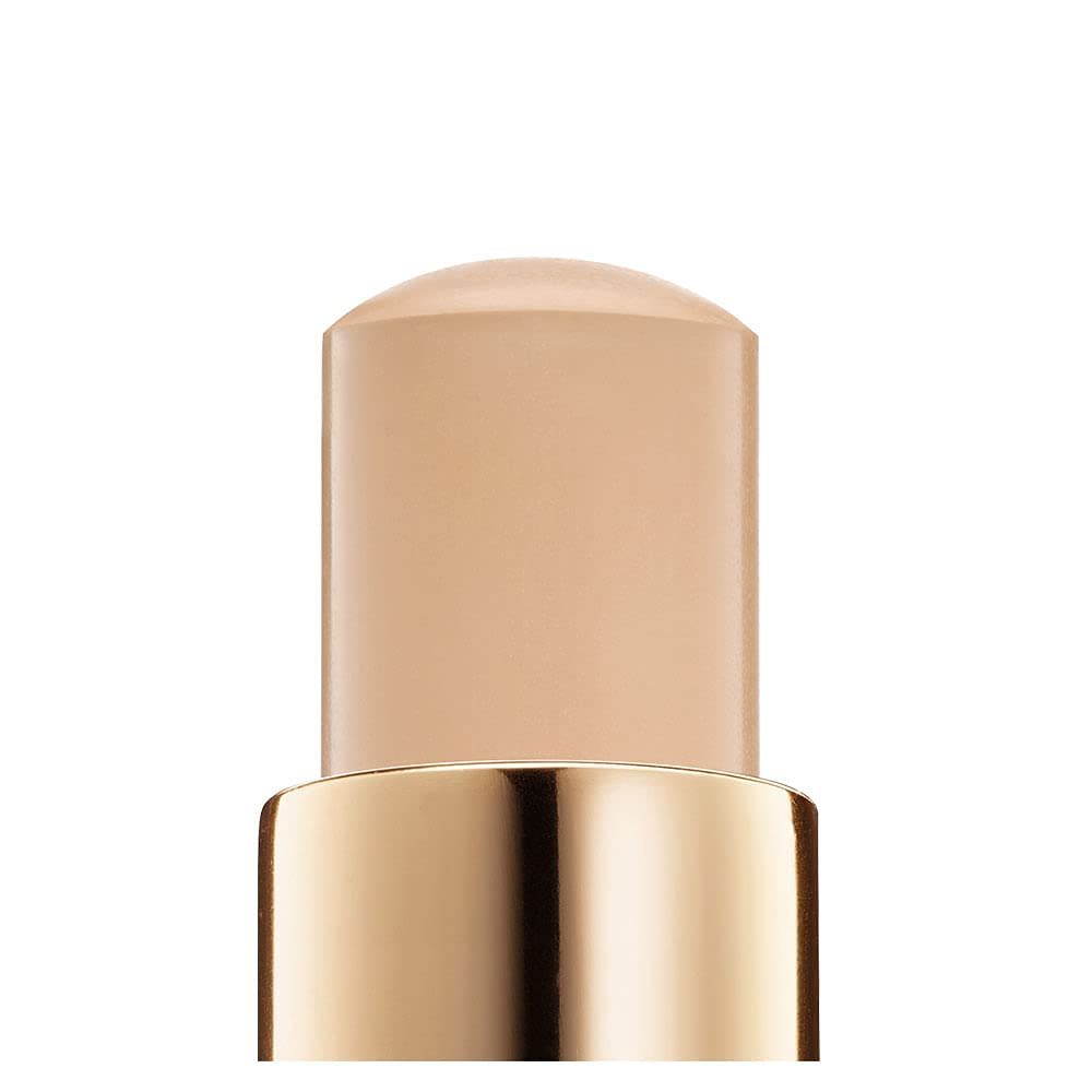 Nahaufnahme des Lancôme Teint Idole Ultra Wear Foundation Stick. Beige Foundation-Stift mit goldfarbenem Hals.